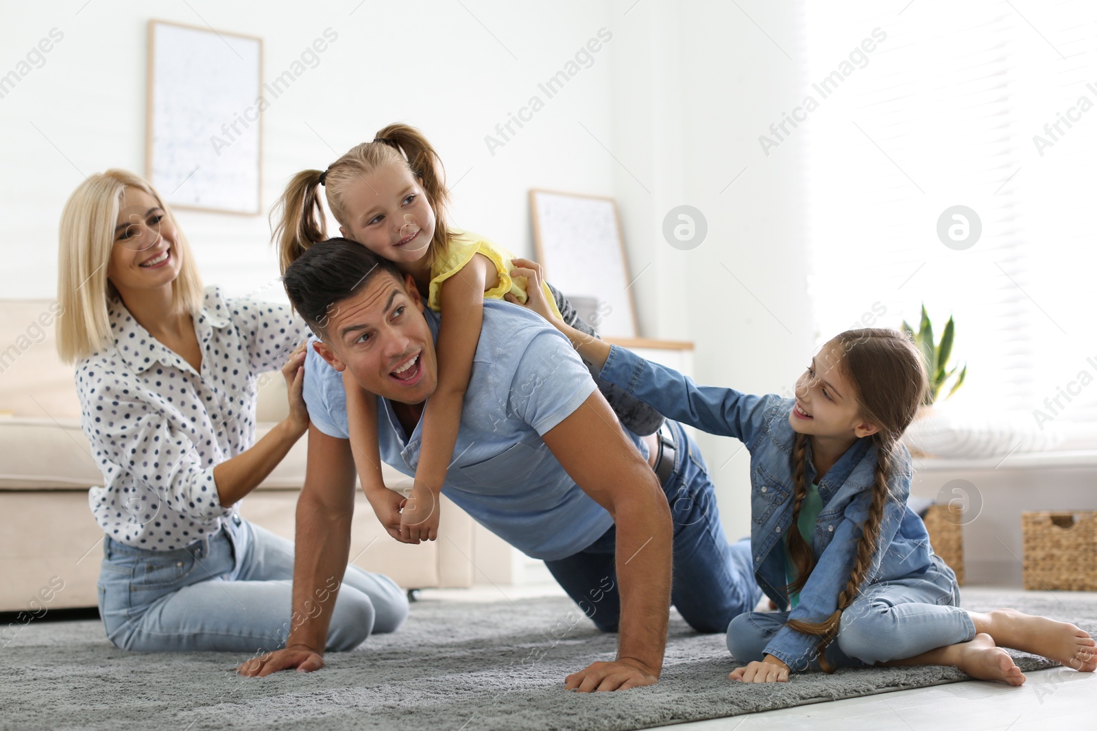 Photo of Happy family spending time together at home