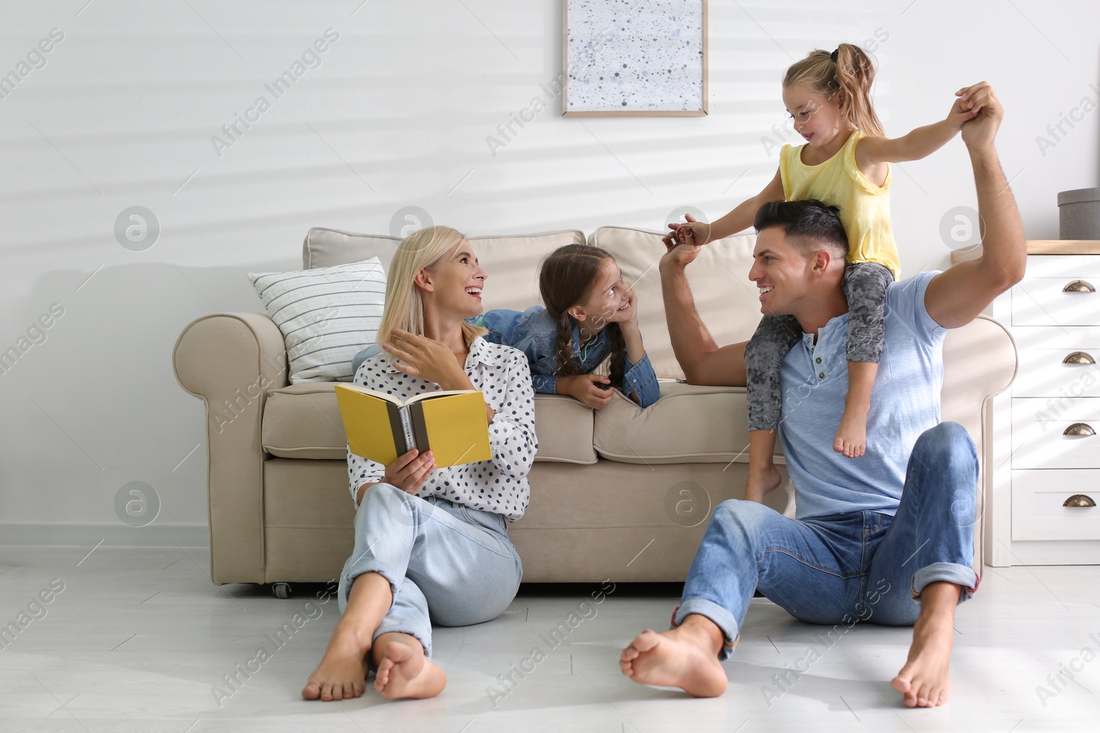 Photo of Happy family spending time together at home