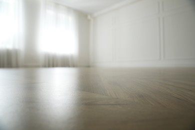 Photo of Parquet floor in light spacious empty room