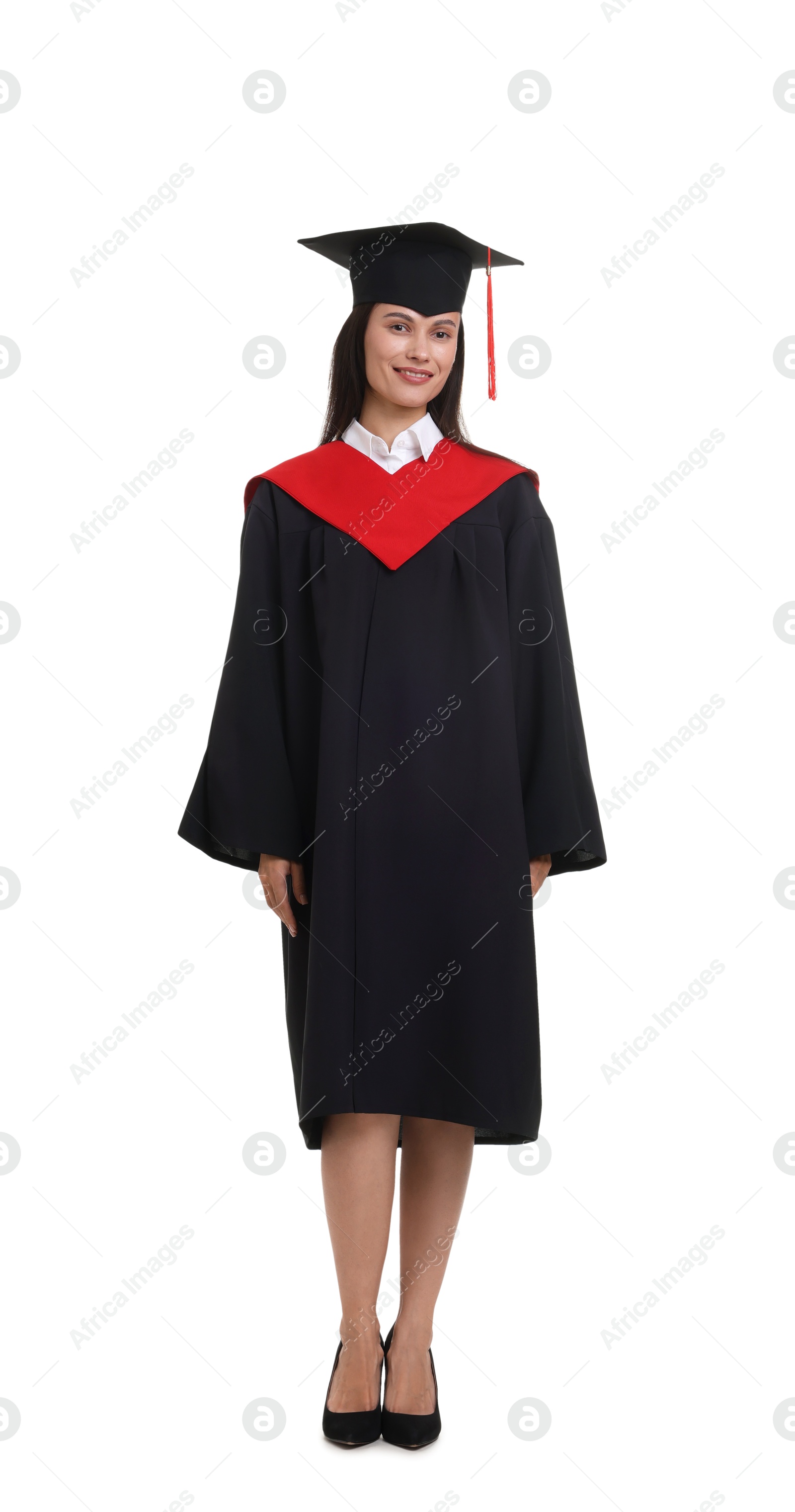 Photo of Happy young woman in graduation gown and mortarboard on white background