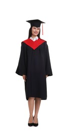 Photo of Happy young woman in graduation gown and mortarboard on white background