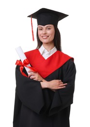 Photo of Portrait of happy young woman in graduation gown and mortarboard with diploma on white background