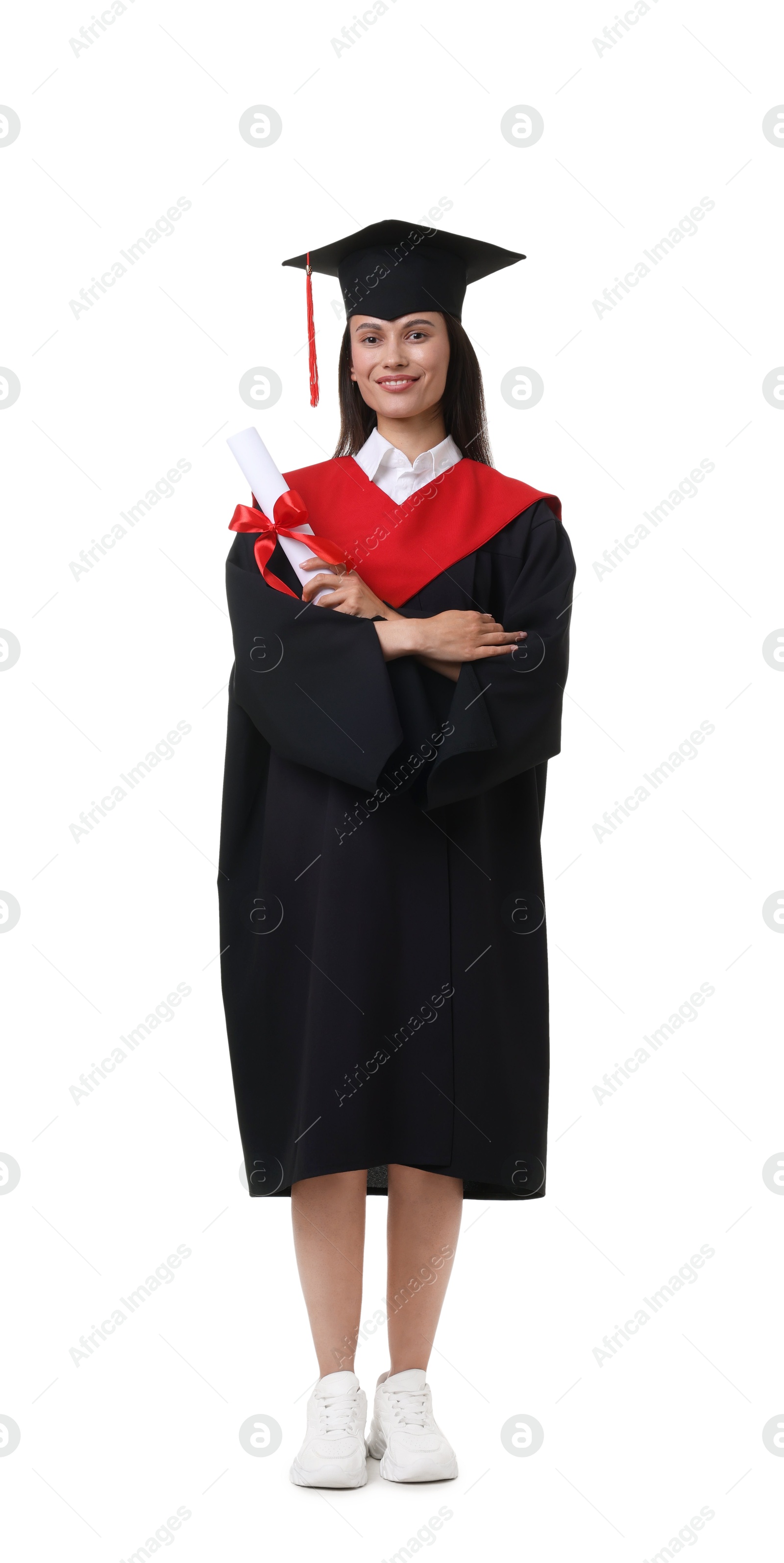 Photo of Happy young woman in graduation gown and mortarboard with diploma on white background