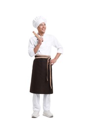 Photo of Professional chef in uniform with rolling pin on white background