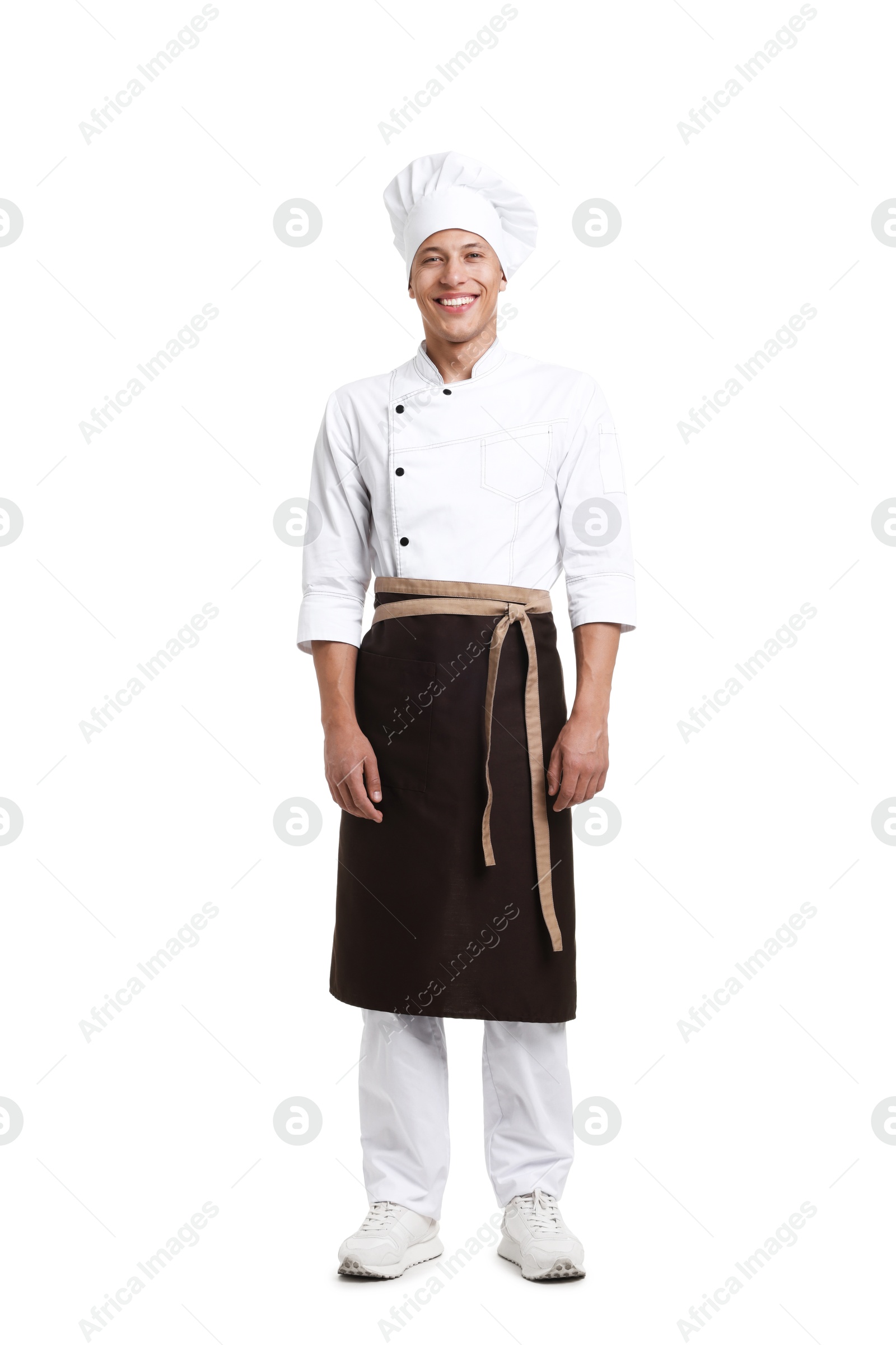 Photo of Full-length portrait of professional chef in uniform on white background