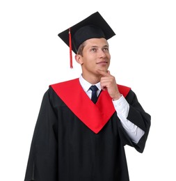 Photo of Portrait of thoughtful young man in graduation gown and mortarboard on white background