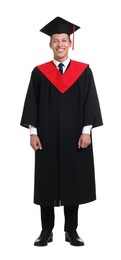 Photo of Young man in graduation gown and mortarboard on white background