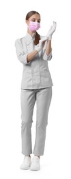 Photo of Full-length portrait of nurse in uniform and medical mask on white background