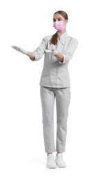 Photo of Full-length portrait of nurse in uniform and medical mask on white background