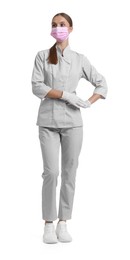 Photo of Full-length portrait of nurse in uniform and medical mask on white background