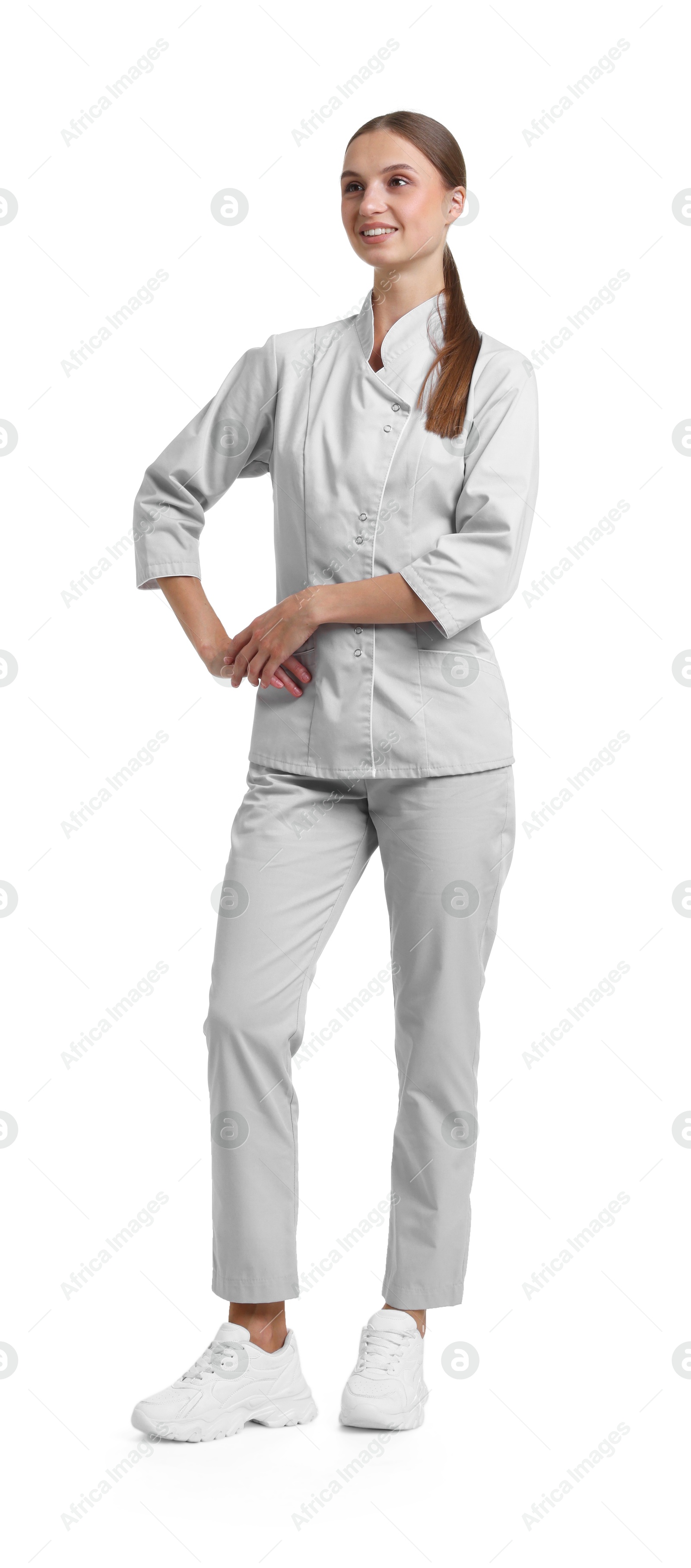 Photo of Full-length portrait of nurse in uniform on white background