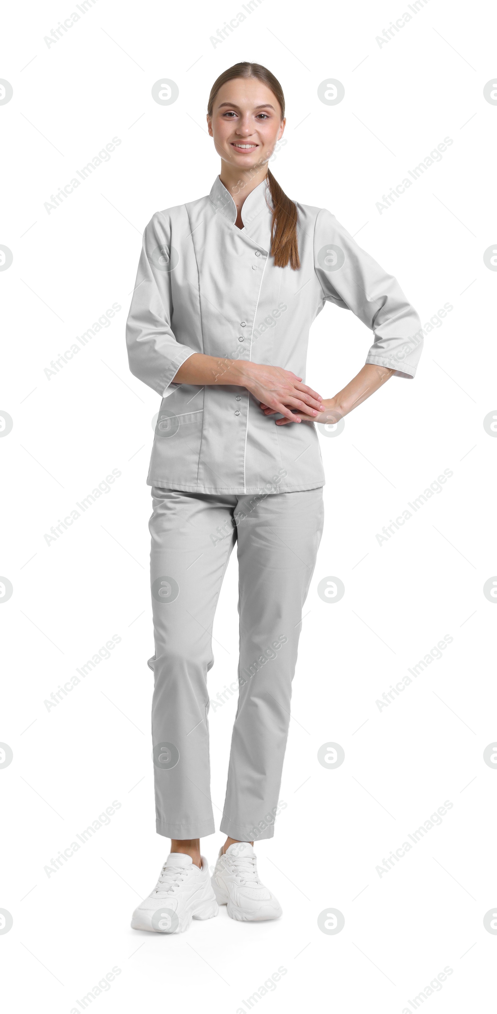 Photo of Full-length portrait of nurse in uniform on white background