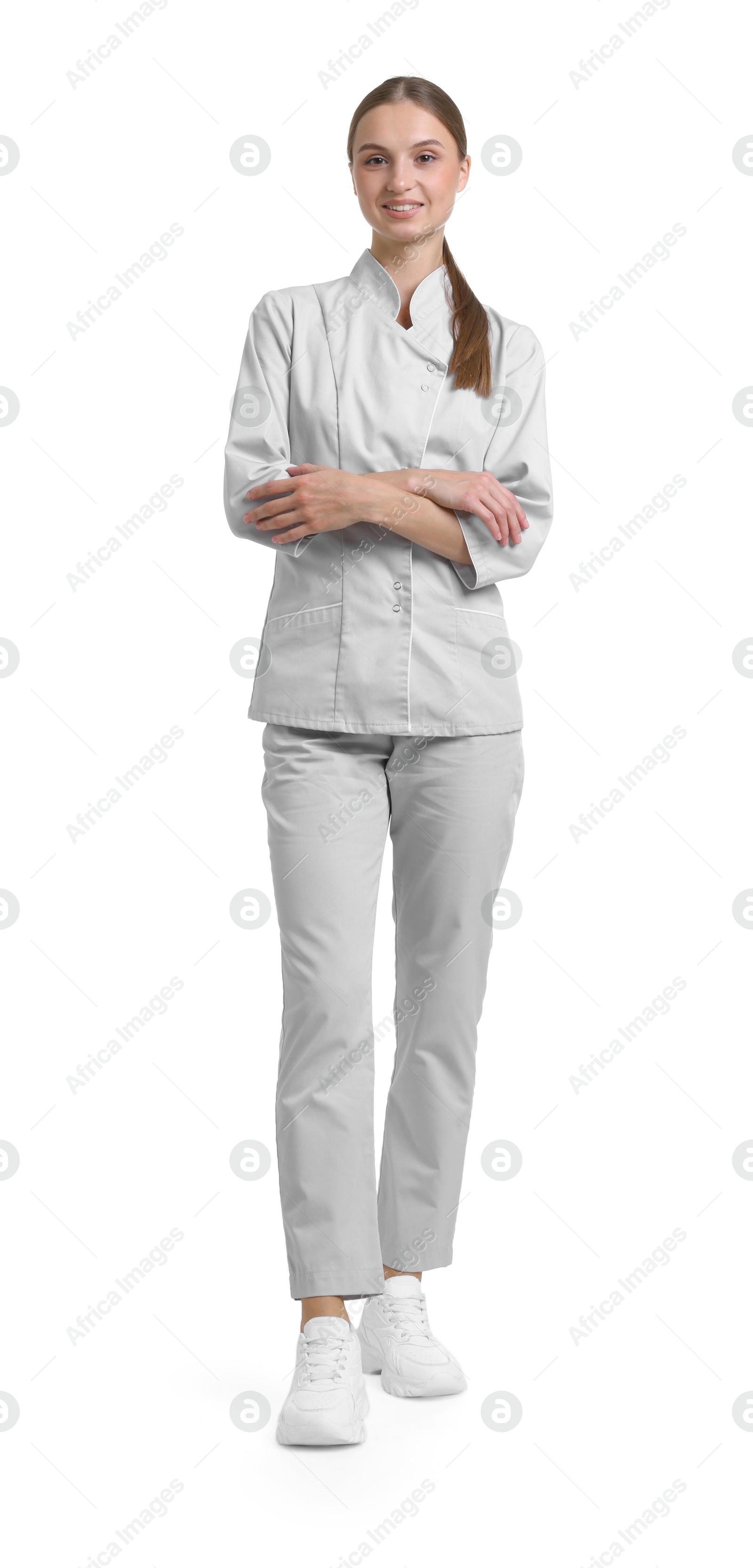 Photo of Full-length portrait of nurse in uniform on white background