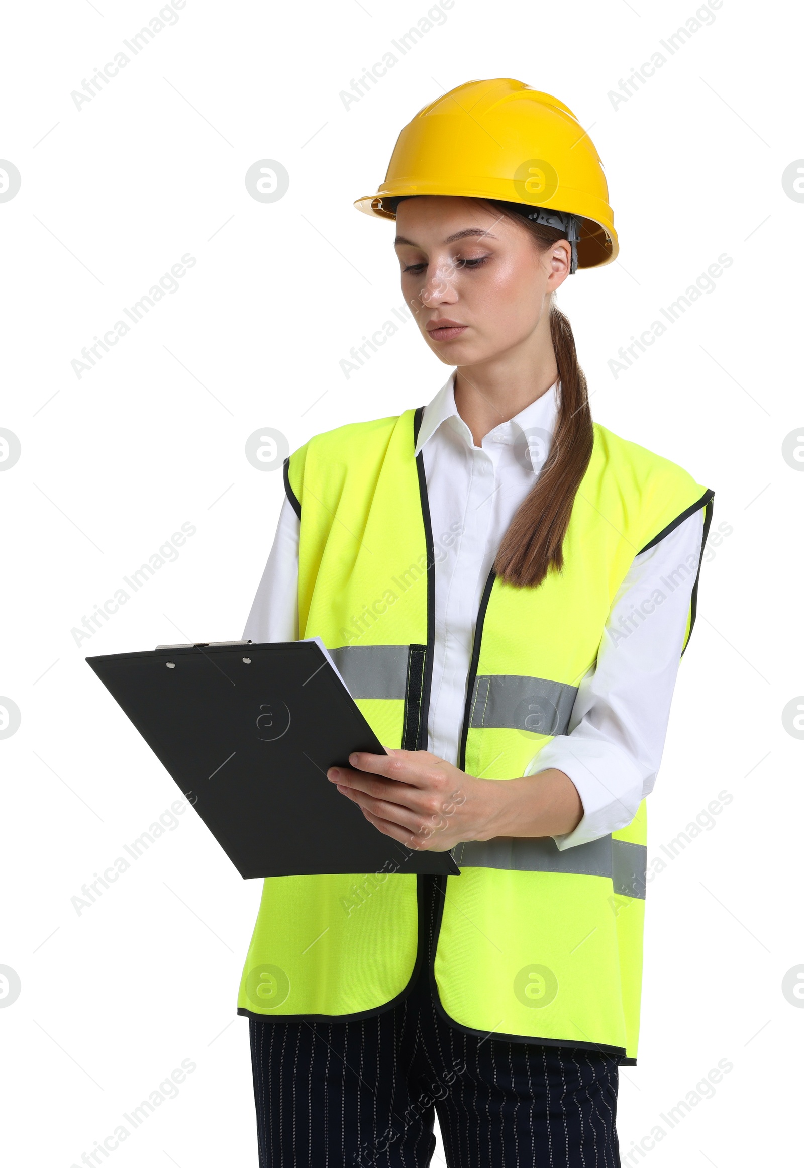 Portrait of engineer in hard hat and reflective vest with clipboard on white background Photo of Portrait of engineer in hard hat and reflective vest with clipboard on white background