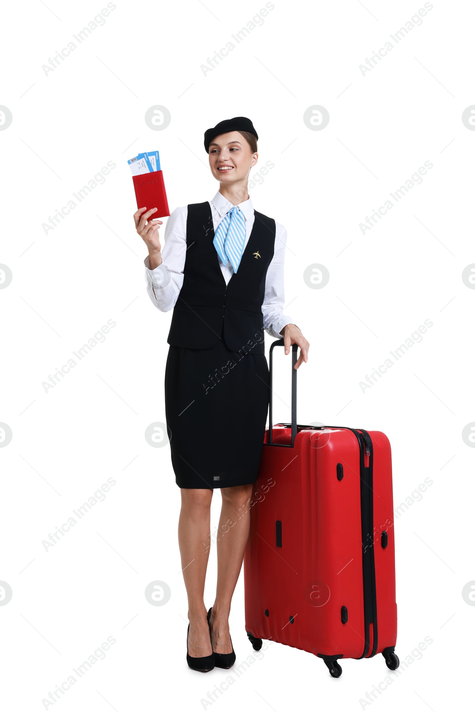 Stewardess in uniform with passport, tickets and suitcase on white background Photo of Stewardess in uniform with passport, tickets and suitcase on white background
