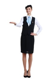 Photo of Young stewardess in uniform on white background