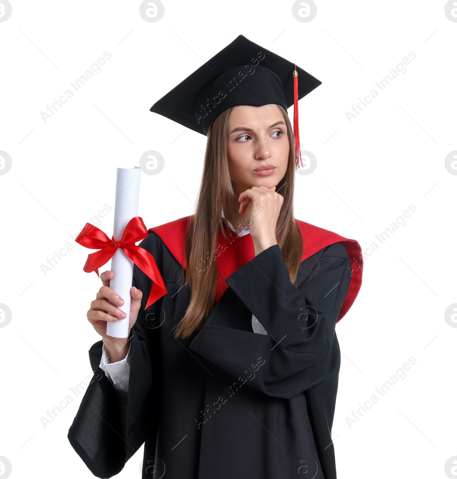 Photo of Portrait of thoughtful young woman in graduation gown and mortarboard with diploma on white background
