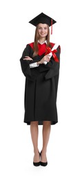 Photo of Happy young woman in graduation gown and mortarboard with diploma on white background