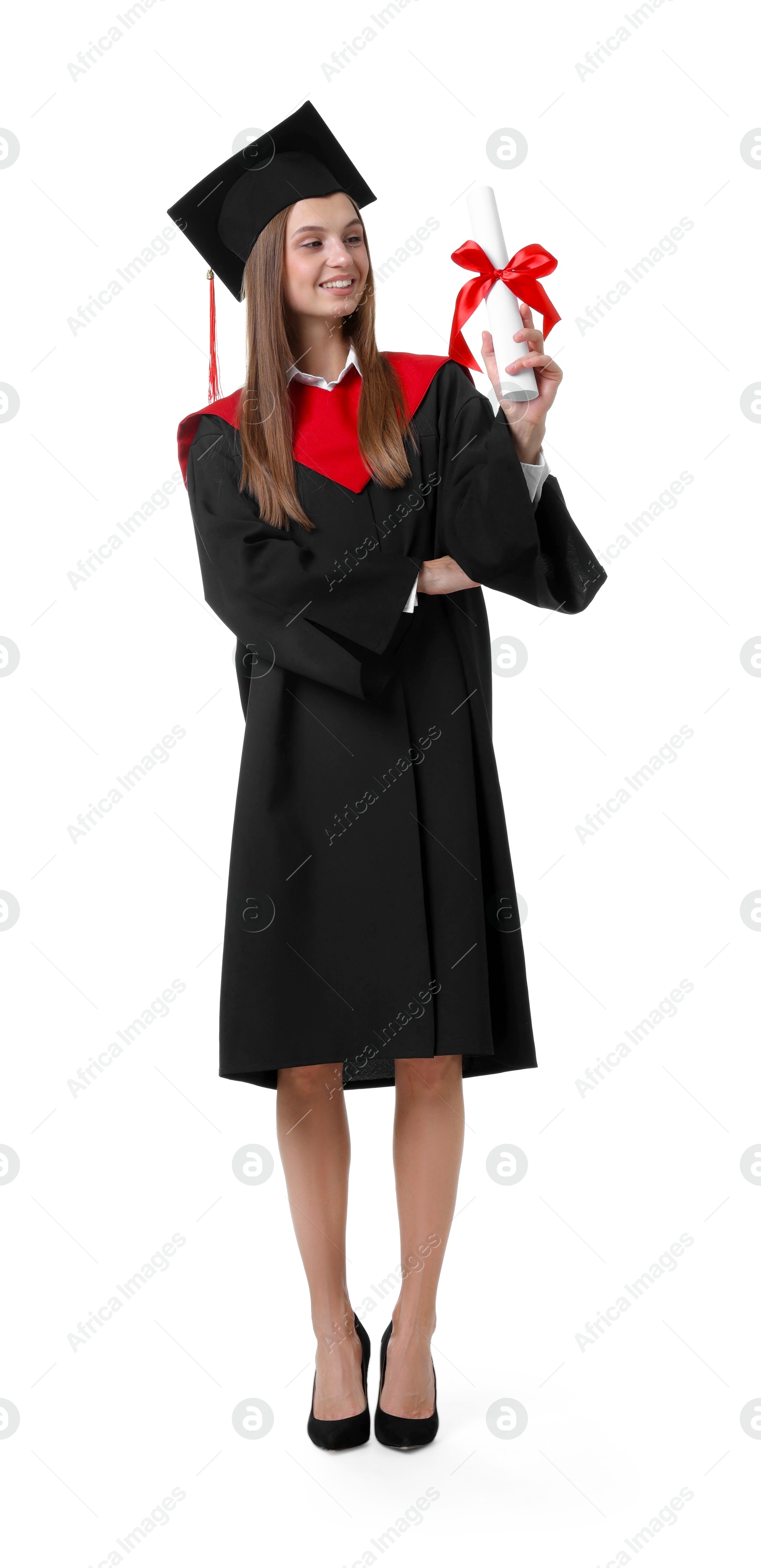 Happy young woman in graduation gown and mortarboard with diploma on white background Photo of Happy young woman in graduation gown and mortarboard with diploma on white background