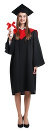 Photo of Happy young woman in graduation gown and mortarboard with diploma on white background