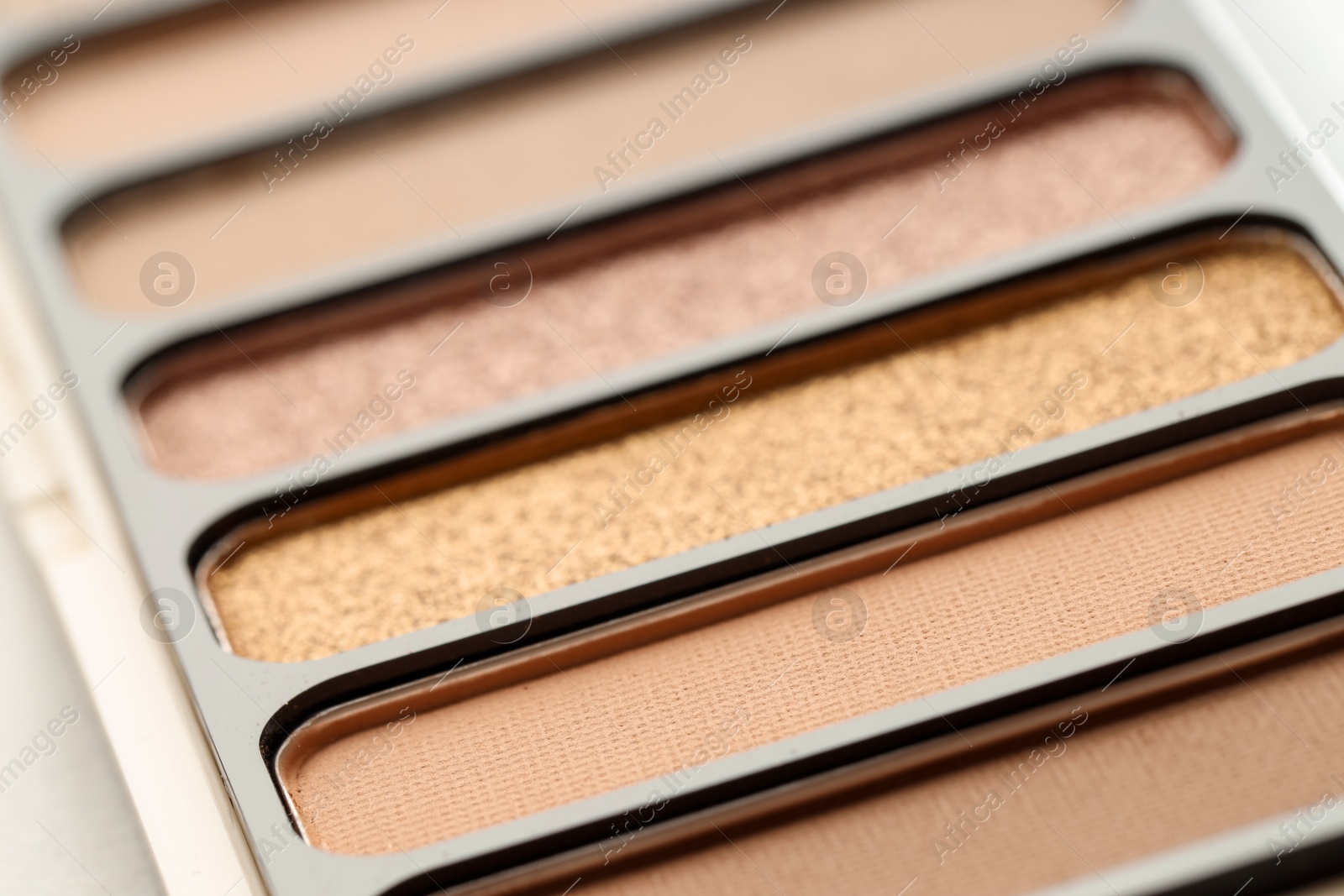 Photo of One beautiful eyeshadow palette on table, closeup