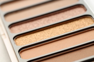 Photo of One beautiful eyeshadow palette on table, closeup
