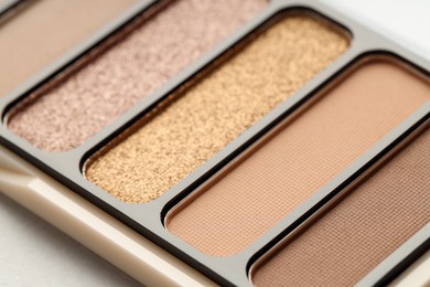 Photo of One beautiful eyeshadow palette on table, closeup