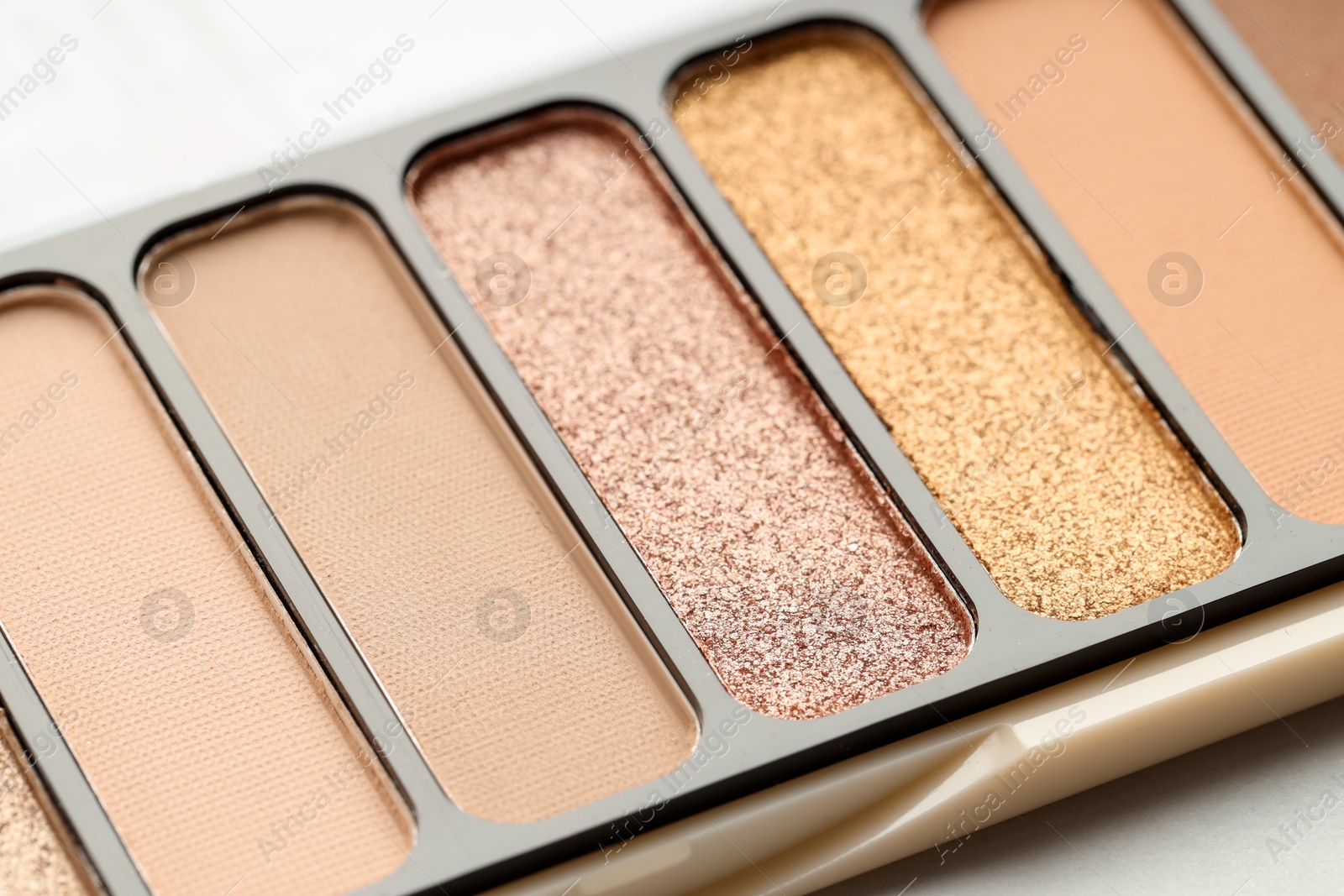 Photo of One beautiful eyeshadow palette on table, closeup