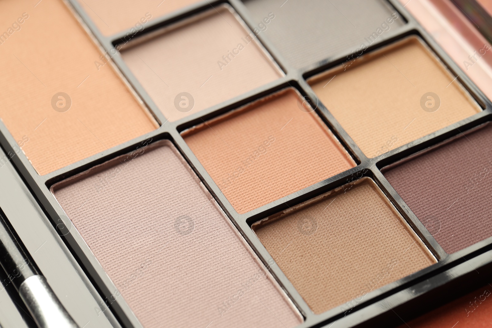 Photo of Beautiful eyeshadow palette as background, closeup. Cosmetic product