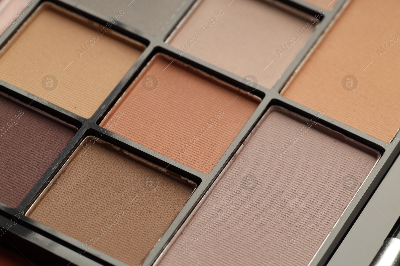 Beautiful eyeshadow palette as background, closeup. Cosmetic product Photo of Beautiful eyeshadow palette as background, closeup. Cosmetic product