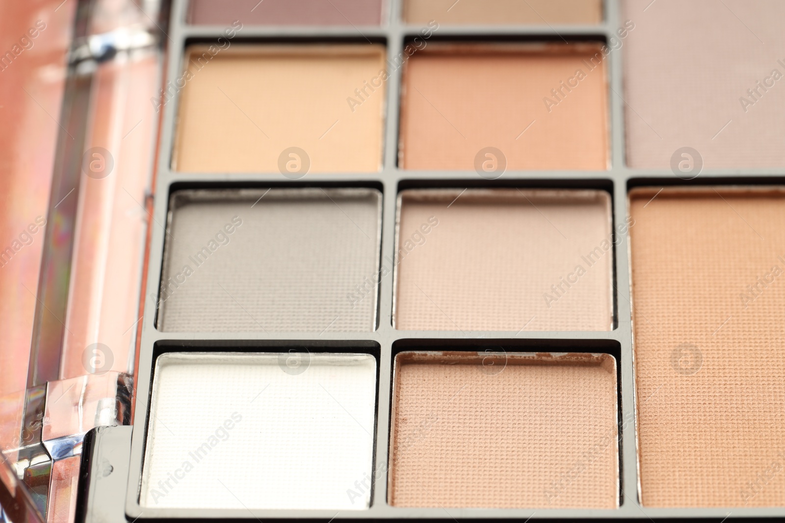 Photo of Beautiful eyeshadow palette as background, closeup. Cosmetic product