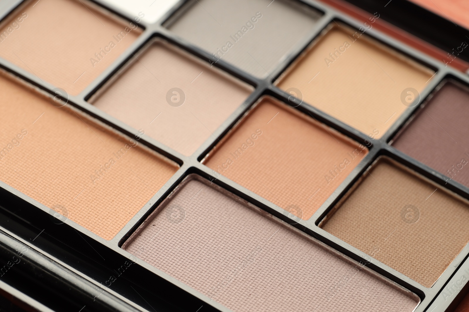 Beautiful eyeshadow palette as background, closeup. Cosmetic product Photo of Beautiful eyeshadow palette as background, closeup. Cosmetic product