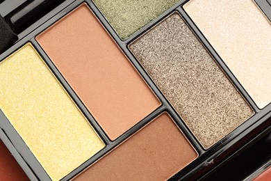 Photo of Beautiful eyeshadow palette as background, top view
