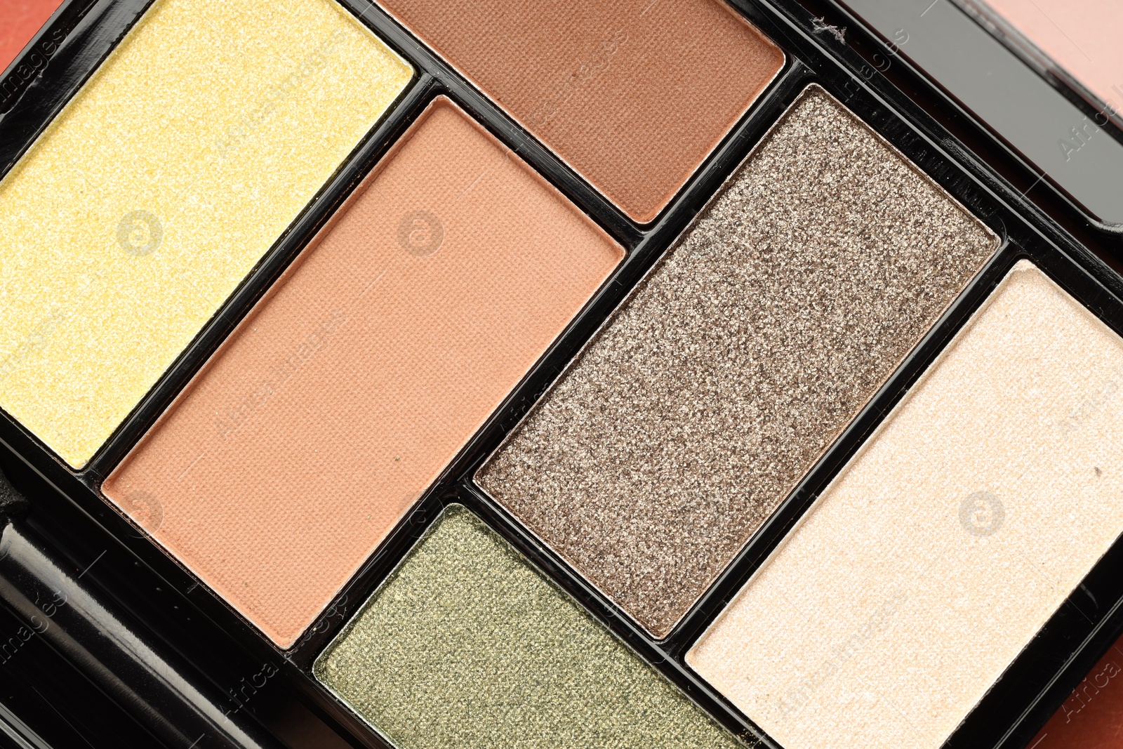 Beautiful eyeshadow palette as background, top view Photo of Beautiful eyeshadow palette as background, top view