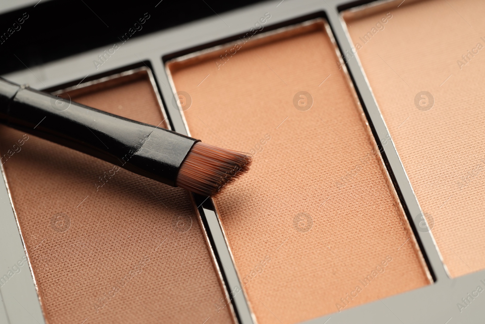 Photo of Beautiful eyeshadow palette and brush as background, closeup