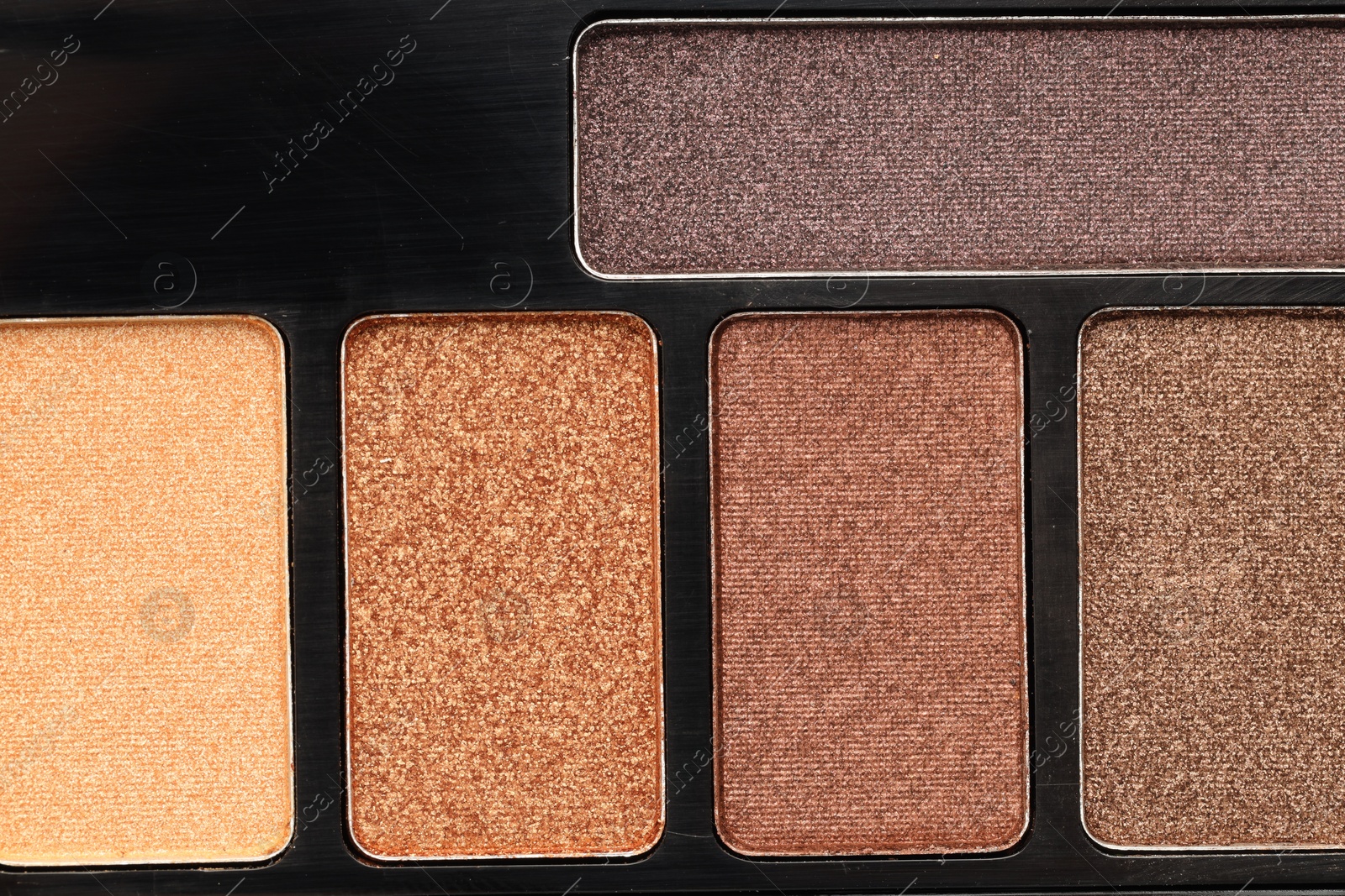 Beautiful eyeshadow palette as background, top view Photo of Beautiful eyeshadow palette as background, top view