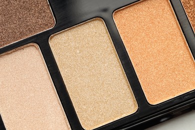 Photo of Beautiful eyeshadow palette as background, top view