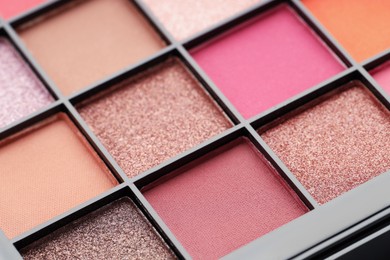 Photo of Beautiful eyeshadow palette as background, closeup. Cosmetic product