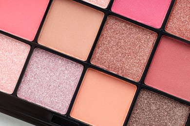 Photo of Beautiful eyeshadow palette as background, top view
