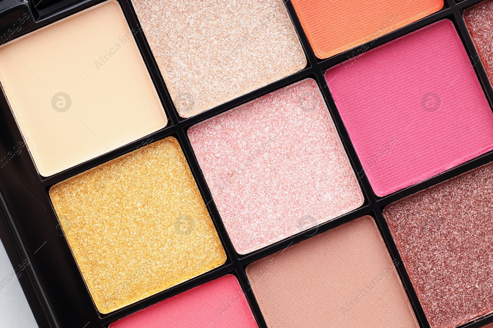 Beautiful eyeshadow palette as background, top view Photo of Beautiful eyeshadow palette as background, top view
