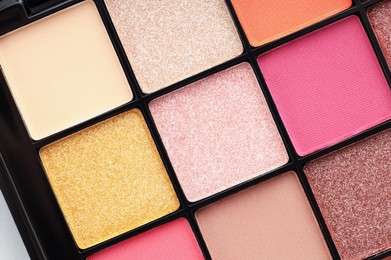 Photo of Beautiful eyeshadow palette as background, top view