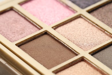 Photo of Beautiful eyeshadow palette as background, closeup. Cosmetic product