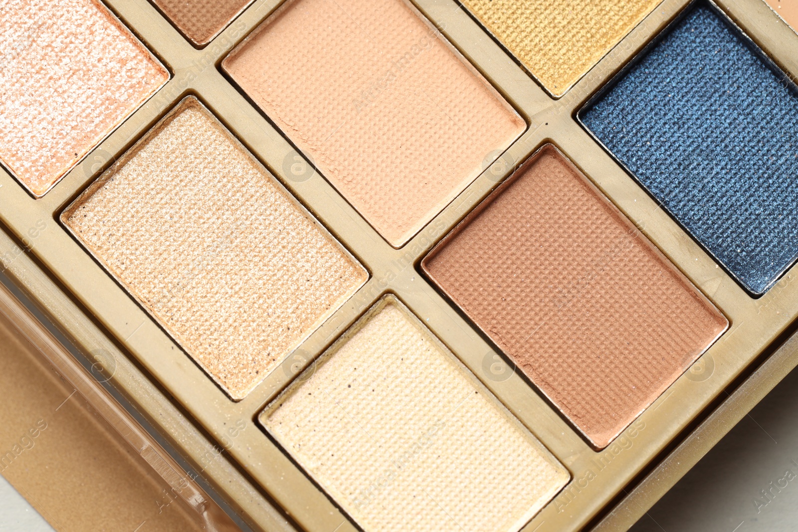 Photo of Beautiful eyeshadow palette on white background, top view