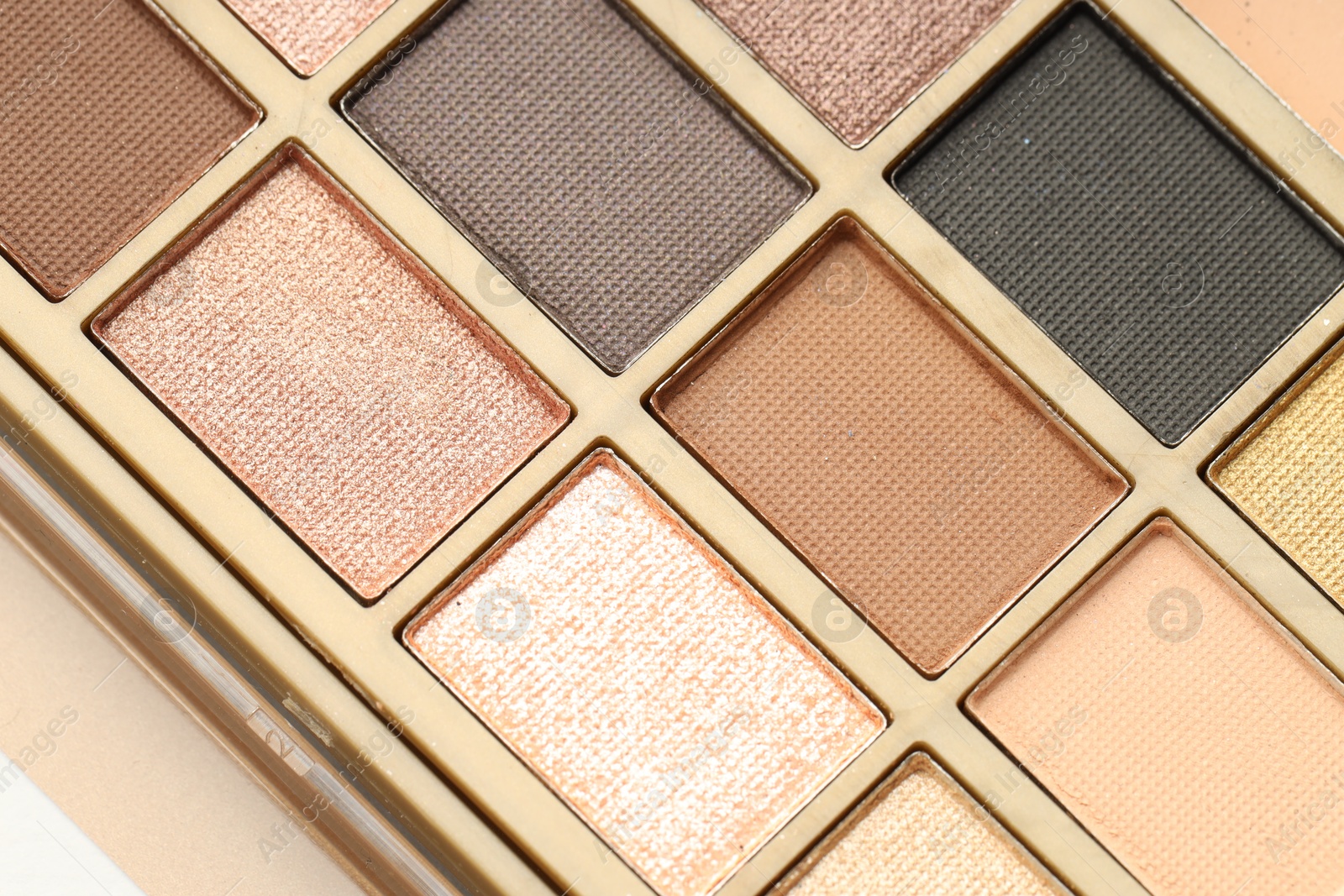 Beautiful eyeshadow palette as background, top view Photo of Beautiful eyeshadow palette as background, top view