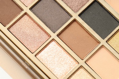 Photo of Beautiful eyeshadow palette as background, top view