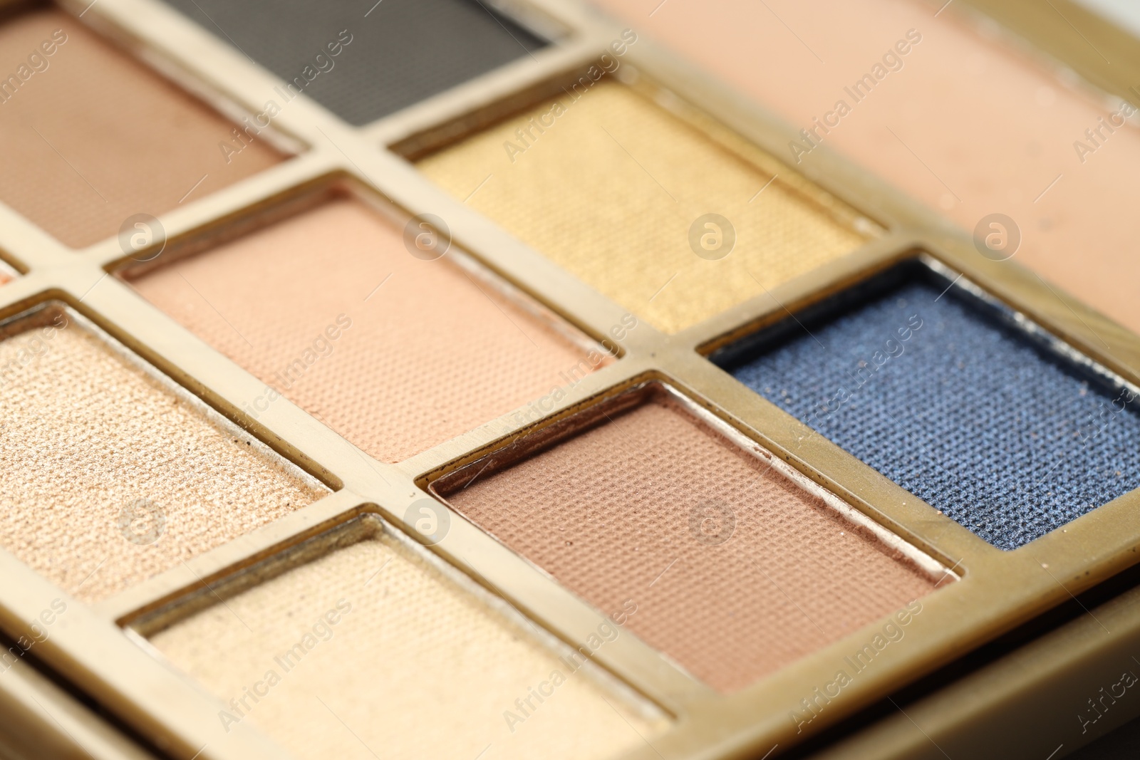 Photo of Beautiful eyeshadow palette as background, closeup. Cosmetic product