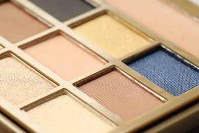 Photo of Beautiful eyeshadow palette as background, closeup. Cosmetic product