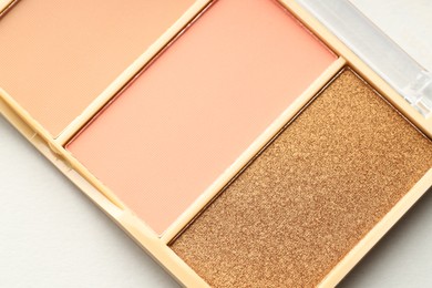 Photo of Beautiful eyeshadow palette on white background, top view