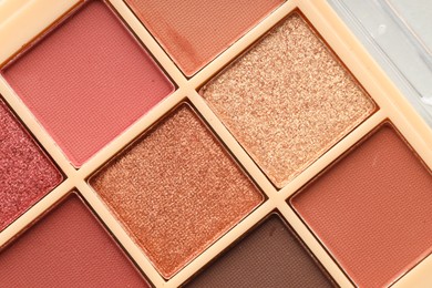 Photo of Beautiful eyeshadow palette as background, top view