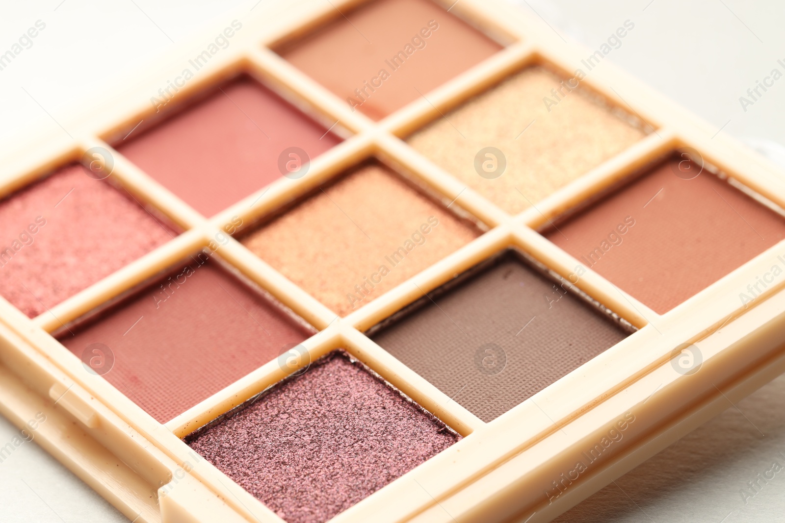 Photo of Beautiful eyeshadow palette on white background, closeup